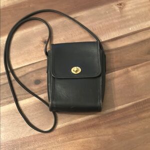 Elegant Coach Black Leather Bag with Gold Accent
